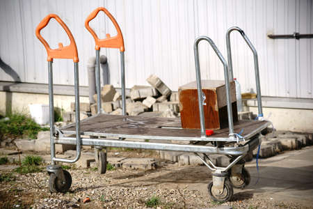 A worn luggage carrier is used for tool transport and material transport.の写真素材
