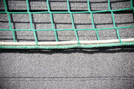 The close-up of stacked Styrofoam plates for heat insulation of a building, which are fixed with a net.                の写真素材