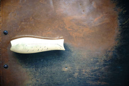 A worn out door knob on a rusty church door.の写真素材