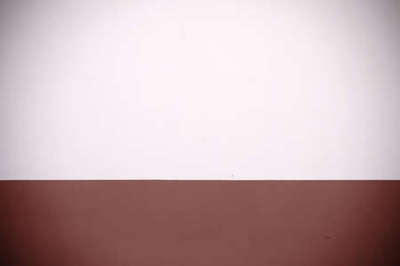 The two-colored wall painting of a house facade via close-up.の写真素材