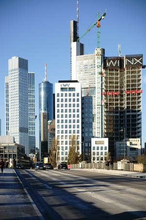Frankfurt, Germany - January 05, 2017: Road traffic and pedestrians cross the Lower Main Bridge in...