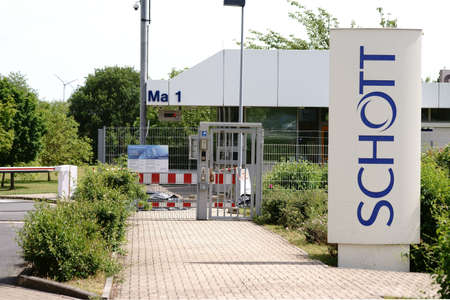 Mainz, Germany - June 08, 2017: The entrance gate and premises of the Schott AG in Mainz with a...