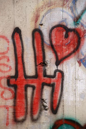 The inscription Hi with a heart above the i on a wall.の写真素材