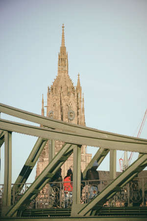 Frankfurt, Germany - January 05, 2017: Visitors crossing the Iron Bridge in direction to the the old town and the Roman Mountain on January 05, 2017 in Frankfurt.のeditorial素材