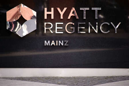 Mainz, Germany - August 21, 2017: The entrance sign of the Hotel Hyatt Regency with reflections in...