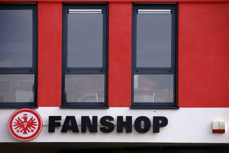 Frankfurt, Germany - September 23, 2017: The coat of arms of the sports club Eintracht Frankfurt on the facade of a fan shop on 23 September 2017 in Frankfurt.のeditorial素材