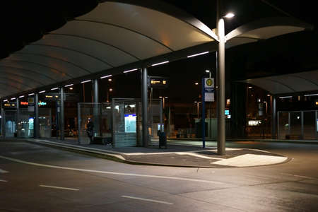 Weinheim, Germany - November 25, 2017: The bus station at the main train station at Weinheim at night on November 25, 2017 in Weinheim.のeditorial素材