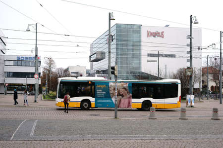Darmstadt, Germany - December 2, 2017: Bus traffic on the square of German Unity in Darmstadt with the Kinopolis cinema on the background on 02 December 2017 in Darmstadt.のeditorial素材