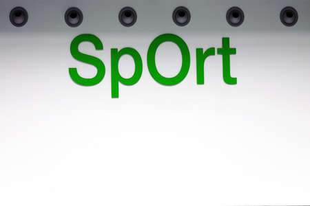 The bright interior wall of a modern sports hall with ventilation pipes.                           の写真素材