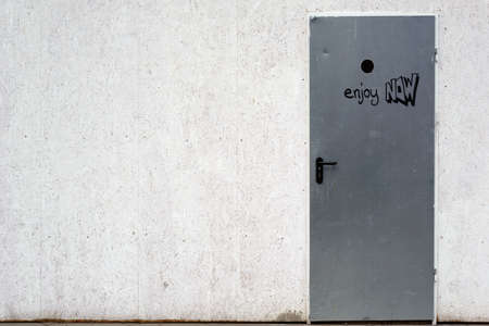 A construction site barrier with a scribbled construction site door and a chipboard fence.                              の写真素材