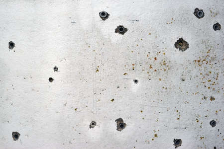 Different sizes of holes with plastic dowels in concrete.                            の写真素材
