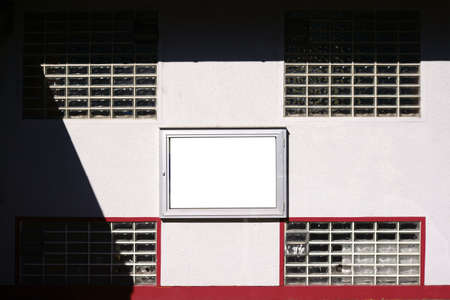 A restaurant showcase on the facade of a restaurant with glass tiles and strong light.                           の写真素材