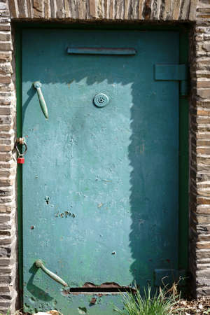 The heavy steel door and fireproof door of a bunker.の写真素材