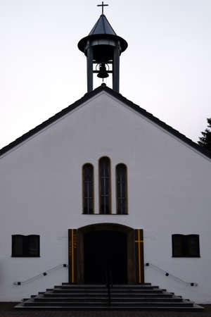 The entrance and the bell tower of the Evangelical Church of the Holy Cross in Griesheim.のeditorial素材