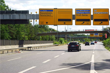A section of the A44 motorway with flowing traffic near Frankfurt with departures to Munich and...