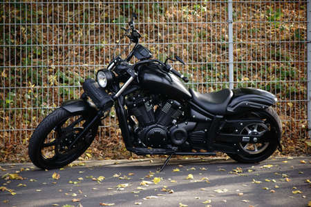 Dreieich, Germany - October 06, 2018: A black matt painted Harley Davidson motorcycle on a parking...