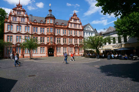 Mainz, Germany - May 27, 2019: Pedestrians and passers-by as well as restaurant visitors of the Hintz and Kuntz in front of the Gutenberg Museum on May 27, 2015 in Mainz.のeditorial素材