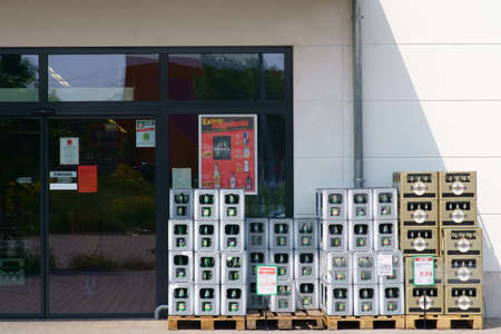 Mainz, Germany - May 24, 2019: Beverage boxes of various mineral water producers in front of the entrance of the professional beverage shop on May 24, 2019 in Mainz.のeditorial素材