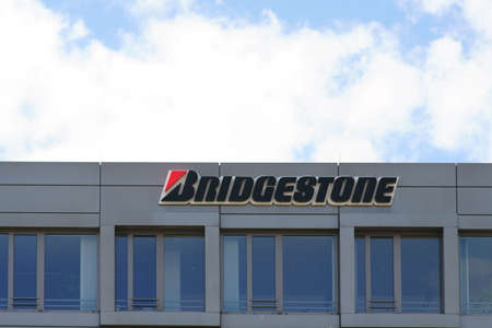 Bad Homburg, Germany - June 09, 2019: The logo of the tire manufacturer Bridgestone on the facade of a business building on 09 June 2019 in Bad Homburg.のeditorial素材