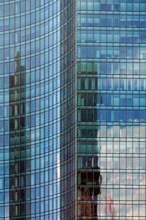 The modern mirror facade of a skyscraper or office building.