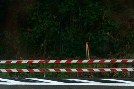 A road barrier at the edge of a platform.の写真素材