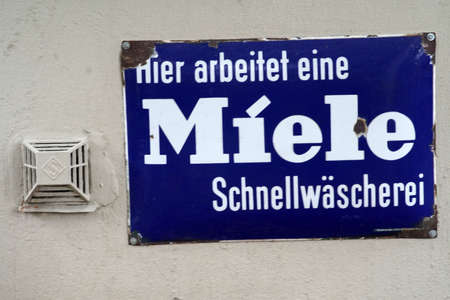 Bad Vilbel, Germany - September 08, 2019: The rusted vintage sign of a laundry with a Miele logo on September 08, 2019 in Bad Vilbel.のeditorial素材