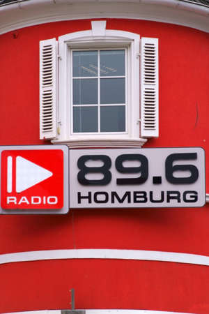 Homburg, Germany - October 19, 2019: The red facade and the sign of radio station 89.6 Homburg on October 19, 2019 in Homburg.のeditorial素材