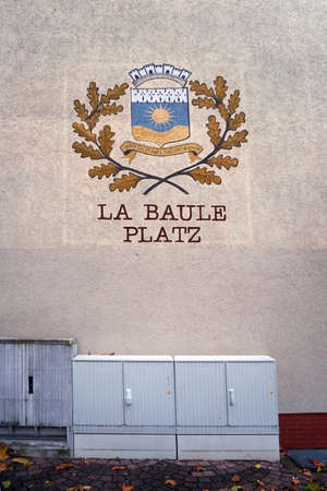 The coat of arms of La Baule Place in Homburg over an electrical distribution box.のeditorial素材