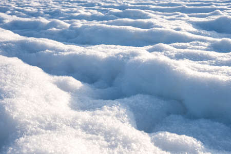 Shining snow background. Beach in winter.