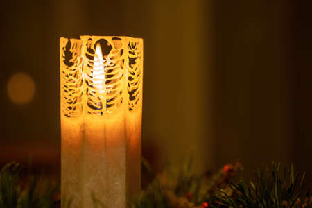 Candle in the pine branch crown.の写真素材