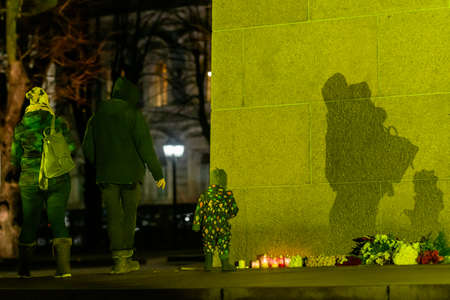 RIGA, LATVIA. 25th February 2022. Monument of Freedom lighted up in Ukraine flag colours.のeditorial素材
