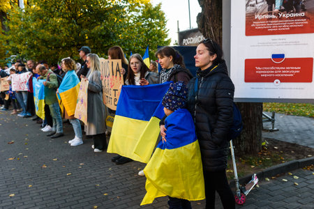 RIGA, LATVIA. 10th October 2022. People condemns Russian airstrikes on Ukraine, during protest near Embassy of Russia in Riga city.のeditorial素材