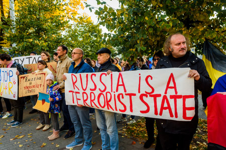 RIGA, LATVIA. 10th October 2022. People condemns Russian airstrikes on Ukraine, during protest near Embassy of Russia in Riga city.のeditorial素材