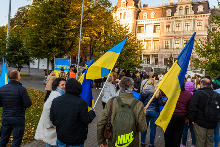 RIGA, LATVIA. 10th October 2022. People condemns Russian airstrikes on Ukraine, during protest near Embassy of Russia in Riga city.のeditorial素材