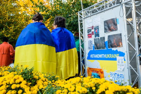 RIGA, LATVIA. 10th October 2022. People condemns Russian airstrikes on Ukraine, during protest near Embassy of Russia in Riga city.のeditorial素材