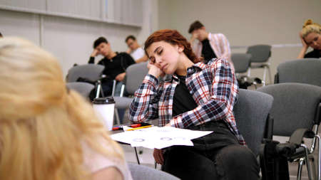 Focus on sleeping girl in university.