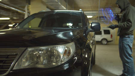 car cracker open the door of car at parking using technology with virtual reality