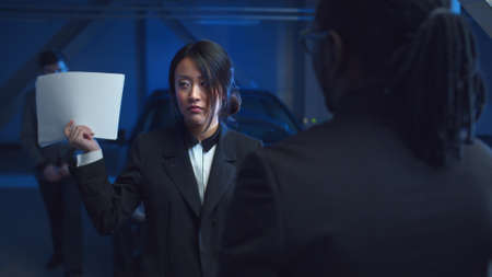 Business deal with documents in the parking lotの写真素材