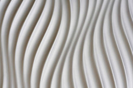 White artistic background with waves lines and shadowsの写真素材