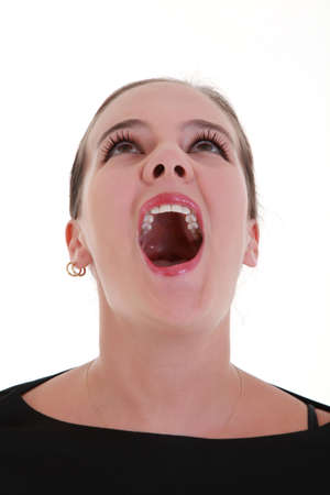 Portrait of afraid screaming young womanの写真素材