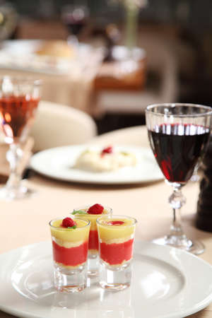 Ice cream in glasses on restaurant tableの写真素材