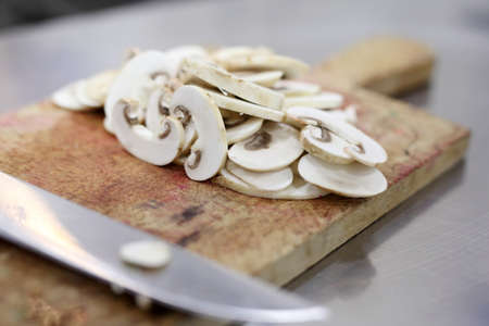White Champignon mushroom just cutted on a kitchen tableの写真素材