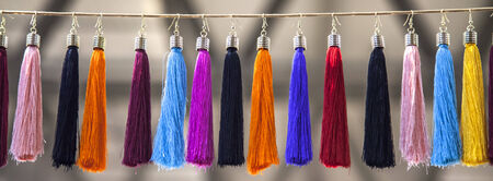 Flakes of fabric hanging on a wireの写真素材