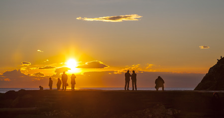 People watching the sunsetの写真素材