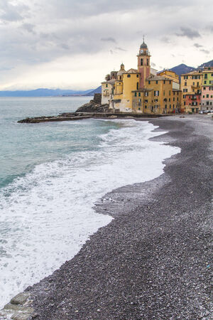 beach and church in Camogli, famous small town in Mediterranean sea, Italy near Genovaの写真素材