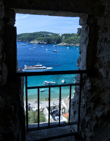 Tremiti bay with boats and transparent sea waterの写真素材