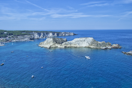 Tremiti islands with blue water, boats and cloudsの写真素材