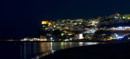 Peschici at night with lights and reflectionsの写真素材