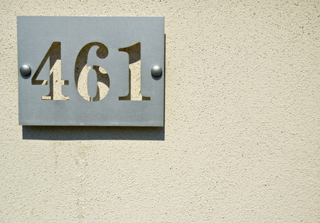 House numbers four hundreds and sixty one (461 four six one) on a gray backgroundの写真素材