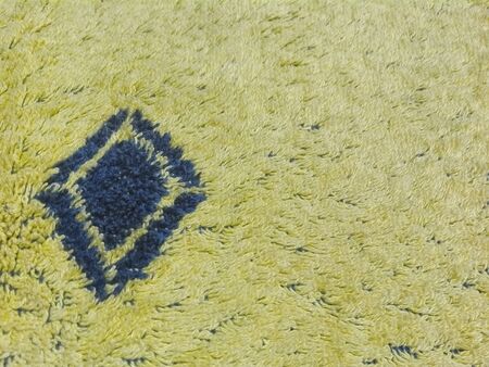 yellow blur background with blue rhombusの写真素材